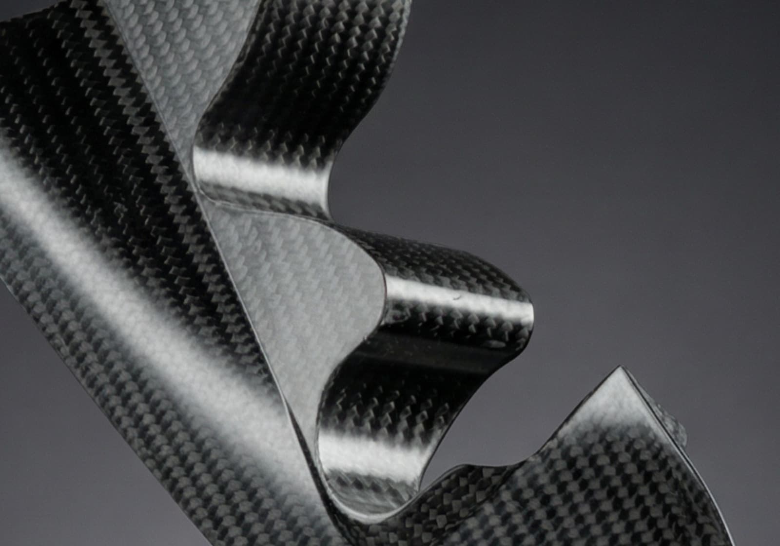 Ex-Core carbon fibre composite part on black background